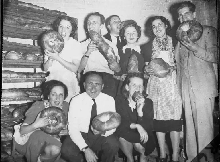 The bakery crew with giant hearth-baked loaves, 1940s